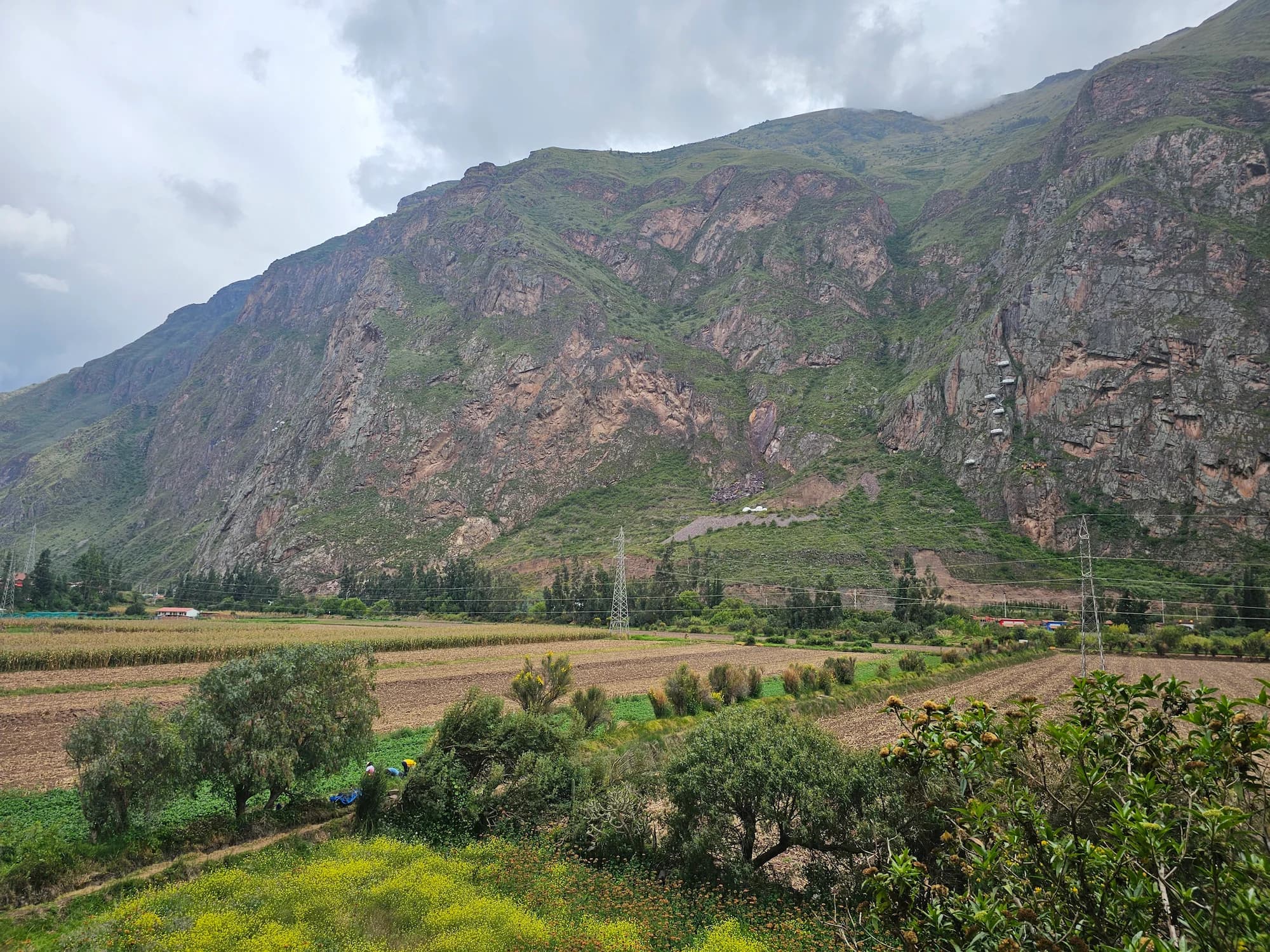 A climber on a steep rock face in the Andes of Peru.