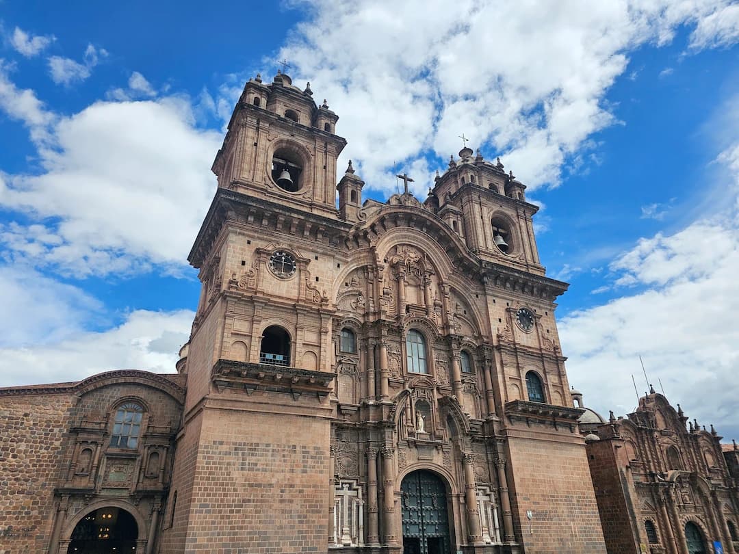 Historic church architecture in Cusco, Peru under a bright sky.