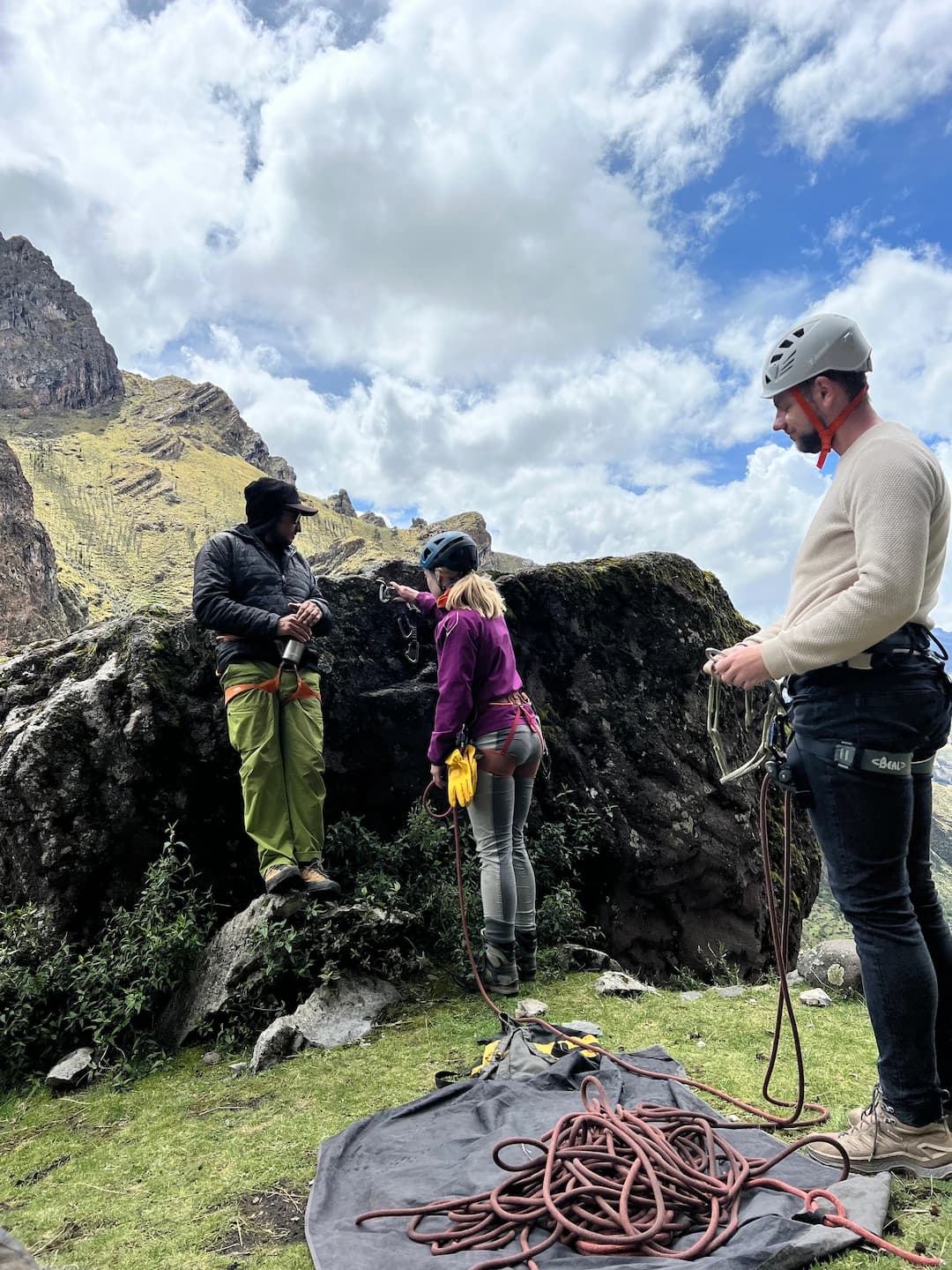 Climbers preparing gear and ropes for a private guided climbing day in Peru.