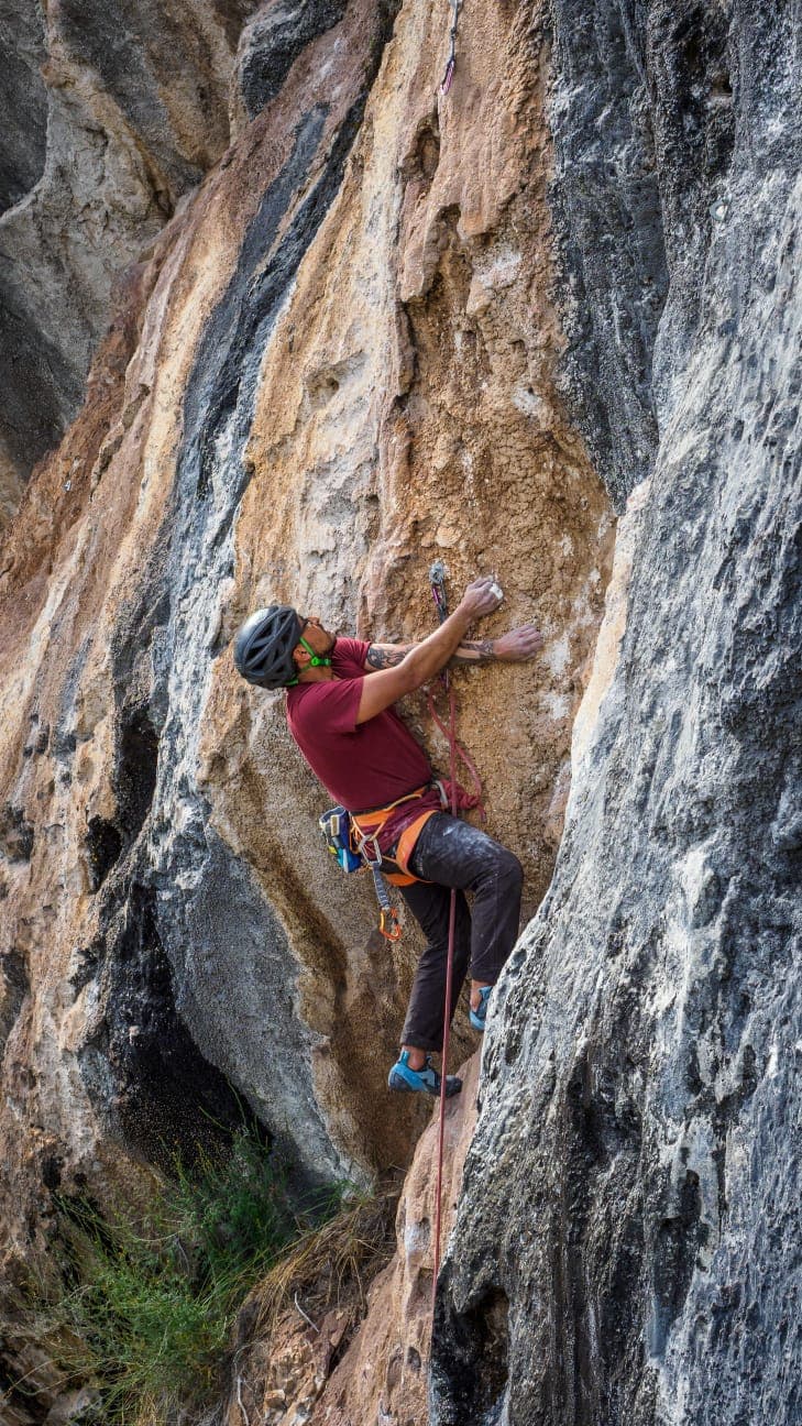 Climber moving through steep rock.